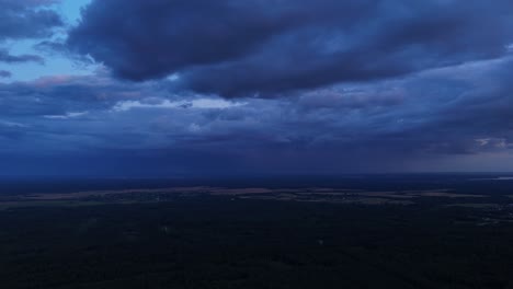 stormy sky over rural landscape at night