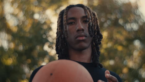 young basketball player holding ball