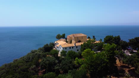 Orbiting-Drone-Shot-of-Paleokastritsa-Monastery-in-Corfu,-Greece