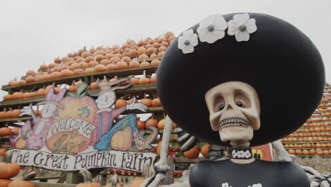 Clarence,NY,-USA,-October-2021:-A-sign-of-the-agricultural-Halloween-fair,-in-the-foreground-a-skeleton-in-a-hat