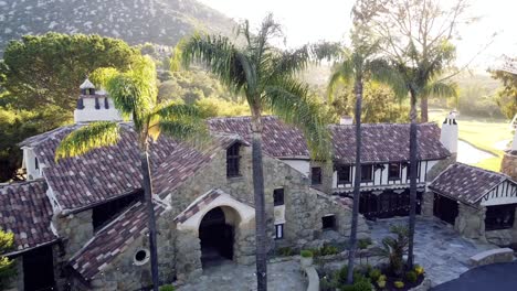 drone flying over a castle at mount woodson