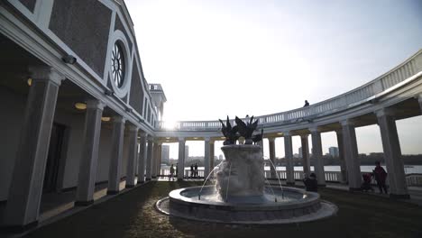 beautiful circular patio with fountain and columns