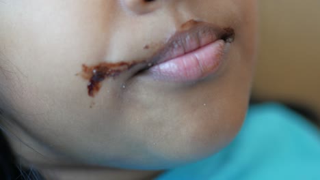 close-up of a child with chocolate on their face