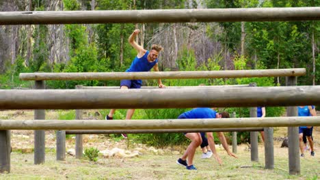 Fit-people-jumping-over-the-hurdles-during-obstacle-course-4k
