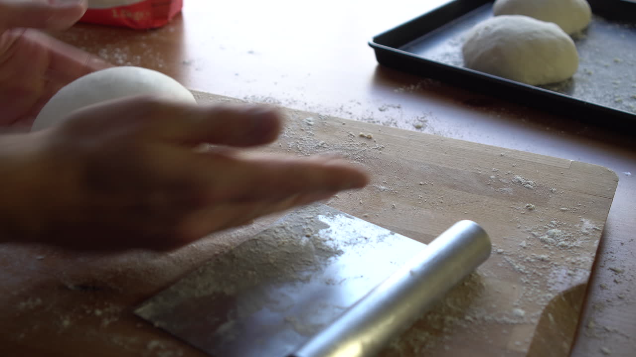 Chef preparing dough for pizza, croissants or bread
