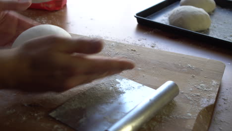 chef preparing dough for pizza, croissants or bread