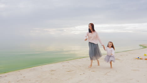 Carefree-Mother-And-Daughter-Three-Years-Running-By-The-Beach
