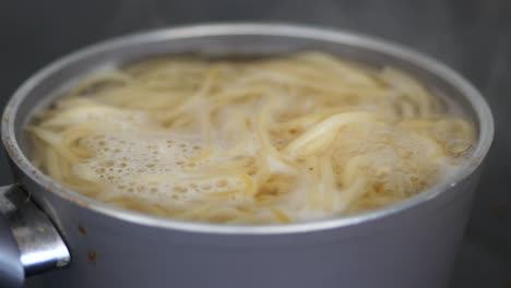 boiling spaghetti in a pot