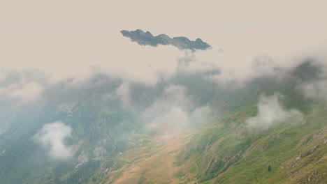 aerial drone view overlooking a valley, foggy morning, passo san marco, italy