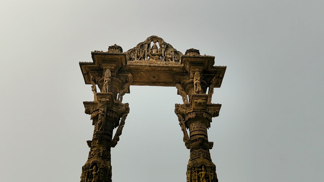 Kirti Toran in Vadnagar, Gujarat, India showing ancient carved stone pillars and heritage architecture representing rich Indian culture and history under clear sky