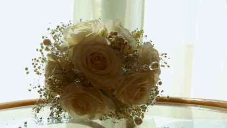 The-bride's-bouquet-on-the-Table---camera-moving-right---close-up