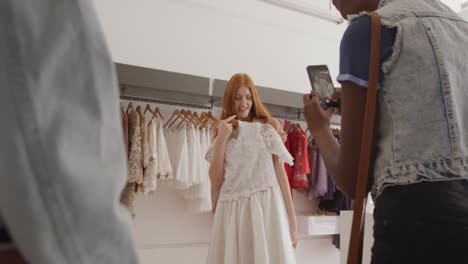 young adult female friends in a clothes shop