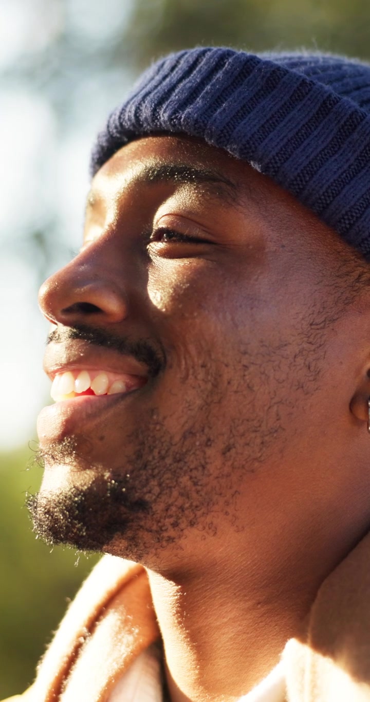 Young Man Enjoying Warm Sunlight Outdoors