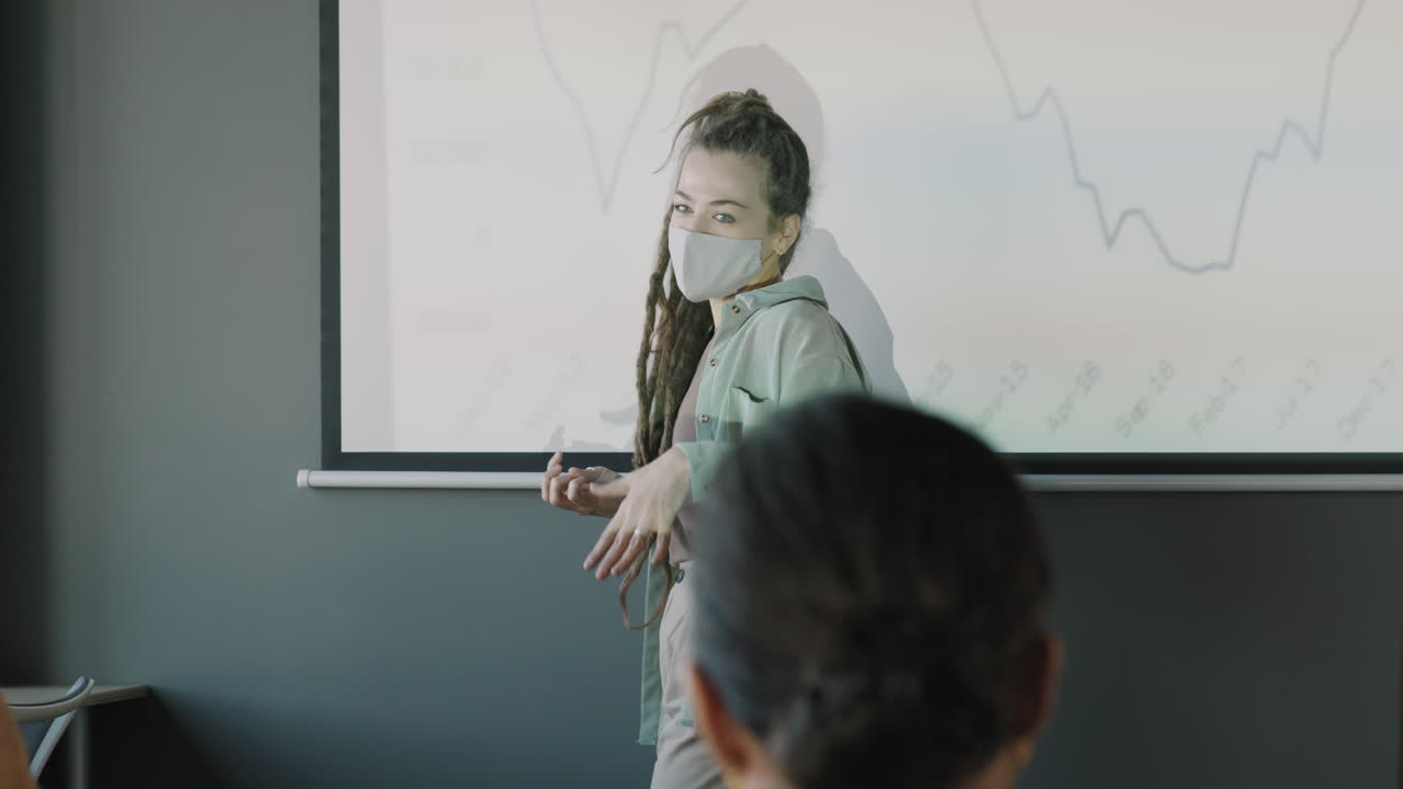 Business Presentation by Woman in Mask