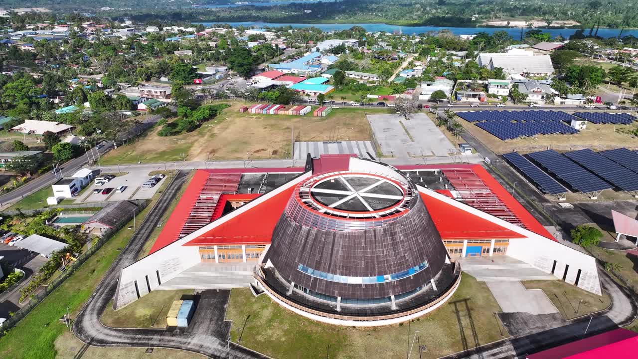Aerial View Of National Convention Center In Port Vila, Vanuatu, With Erakor Lagoon Revealed. tilt-up shot