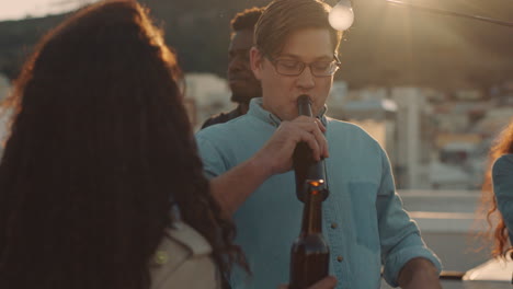 group-of-diverse-friends-hanging-out-dancing-together-enjoying-rooftop-party-at-sunset-drinking-alcohol-having-fun-on-weekend-celebration