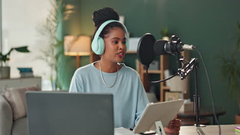 woman recording podcast with microphone and headphones