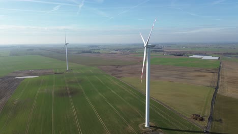 windmill spin blades on wind sunny day aerial circulating