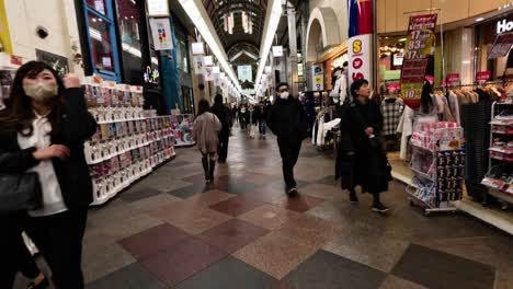 people walking through a busy shopping mall