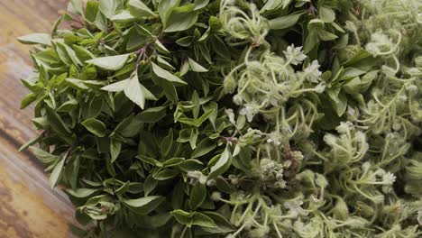 plate of edible leaves and flowers rotating on the table