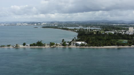 push in aerial flight along the coast line of isla de cabra, puerto rico