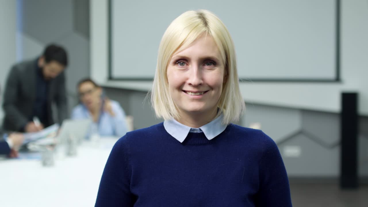 Joyous Mid-Aged Businesswoman Posing in Office