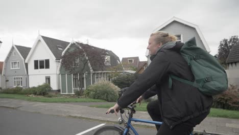 girl rides a bicycle on a cold day, in south of amsterdam