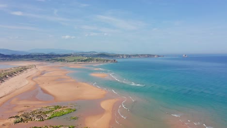 huge beach in liencres dunes natural park in north sunny spain