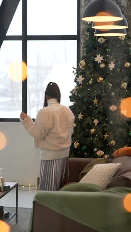 christmas decor in modern living room with woman