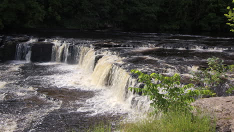 wide shot of the upper falls at aysgarth falls on the river ure, yorkshire dales