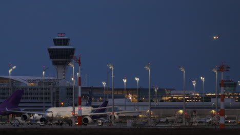 airplane landing at airport at night