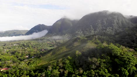 Mountain-clearing-over-Valle-de-Anton-valley-in-central-Panama-located-in-extinct-volcano-crater-with-low-clouds,-Aerial-flyover-shot