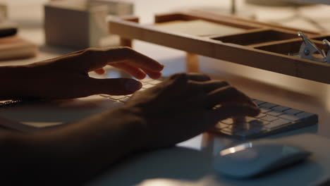 close up hands typing business woman working late in offce using computer sending emails networking online planning deadline for corporate project at night