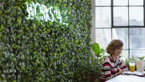 beautiful caucasian woman student discussing ideas enjoying conversation colleagues sharing social connection in sustainable startup office workplace