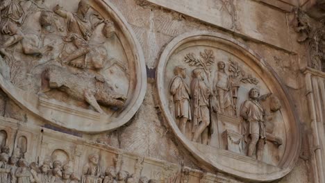 Close-up-of-antique-stone-mosaic-with-detailed-humaniod-scultures-at-a-historical-building-from-the-ancient-roman-empire-in-Rome,-Italy