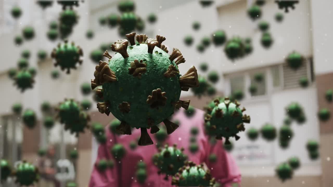 마스크를 쓰고 있는 사람 위의 매크로 코로나 19 세포의 애니메이션