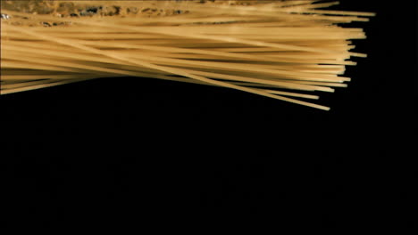 spaghetti in super slow motion falling in the water