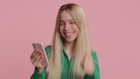 happy excited winner woman use smartphone say wow yes found out great big win good news lottery