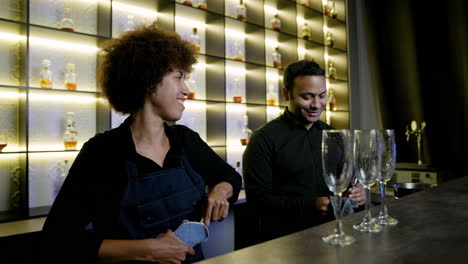 bartenders working in the pub