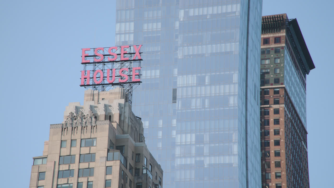 Establishing shot of Essex House and the Manhattan skyline. Shot on a summer morning in New York City