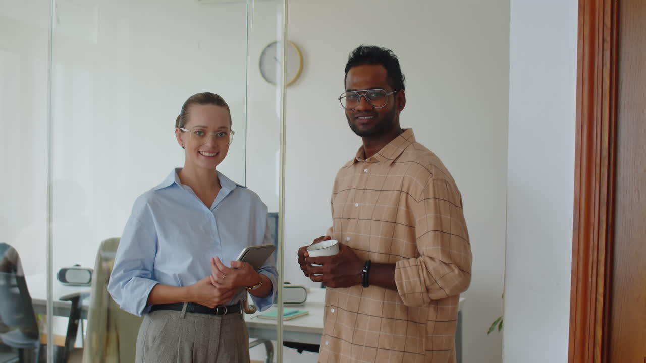 Portrait of Biracial Specialists Meeting at Office to Discuss Plans