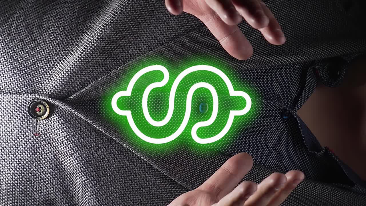 손 사이 에 시각적 인 녹색 달러 기호 를 들고 있는 사업가 를 보여 주는 클로즈업  ⁇  - 디지털 모션 그래픽 기호