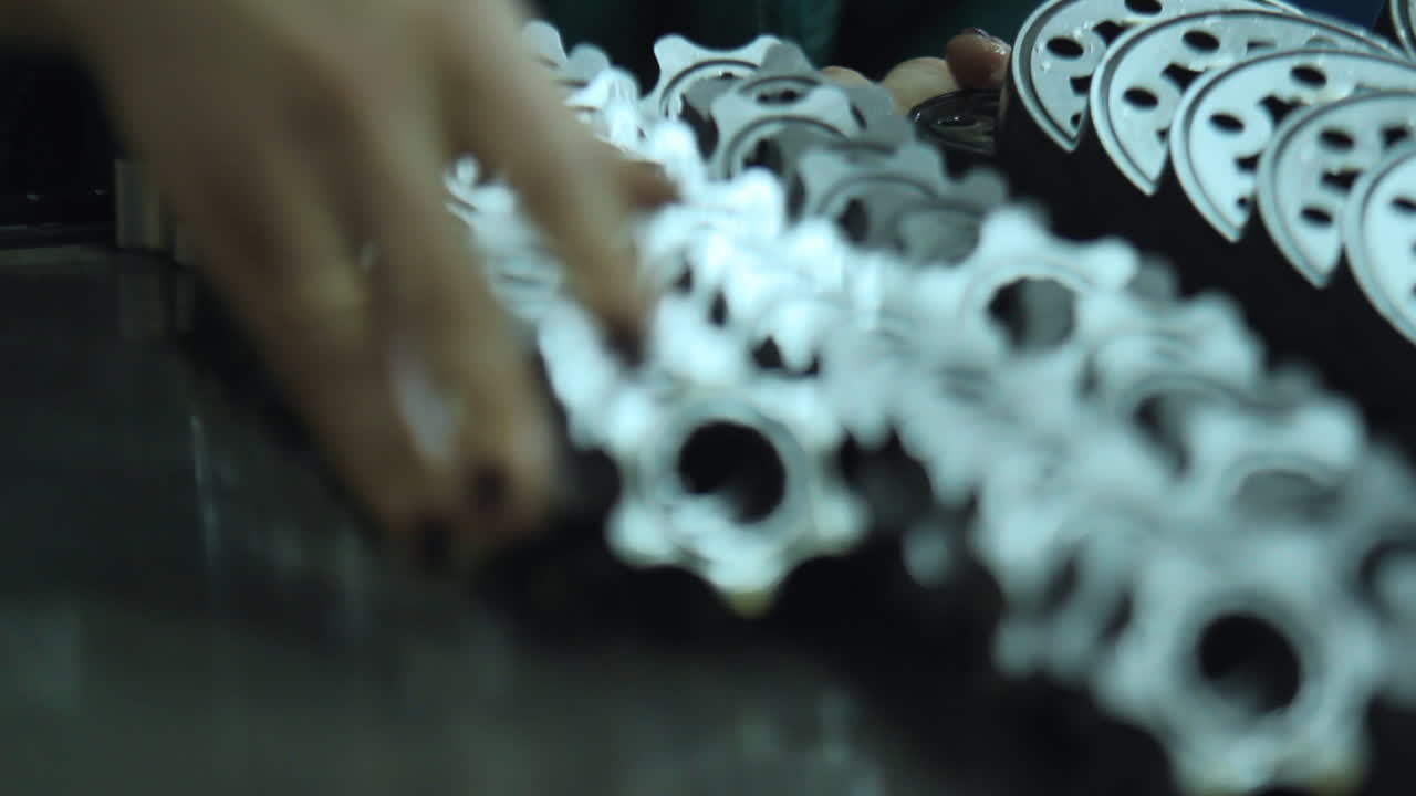 Machine tool parts manufacturing. Rows of metal billets with internal thread