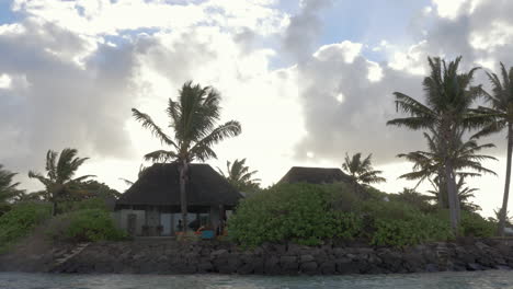 houses in tropics view from sailing boat