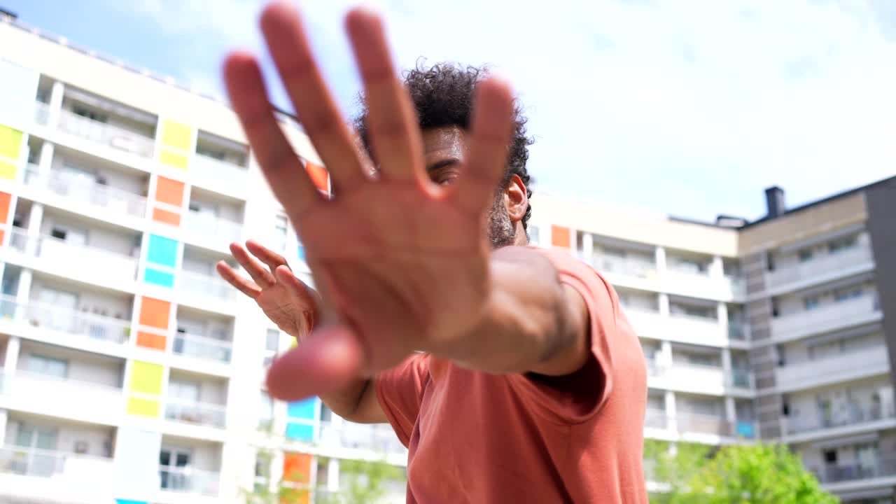 Man outdoors in front of building