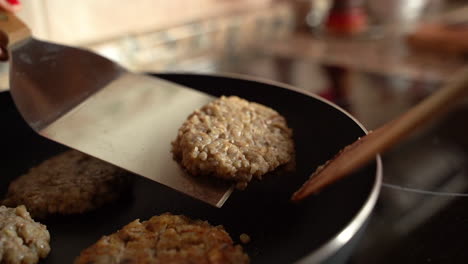 close up of vegan lentil burger in pan