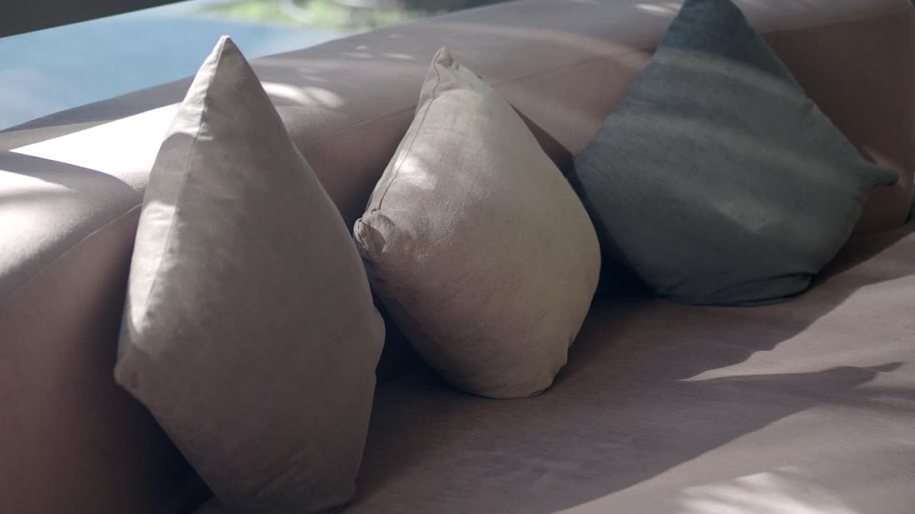 Three Pillows on a Couch