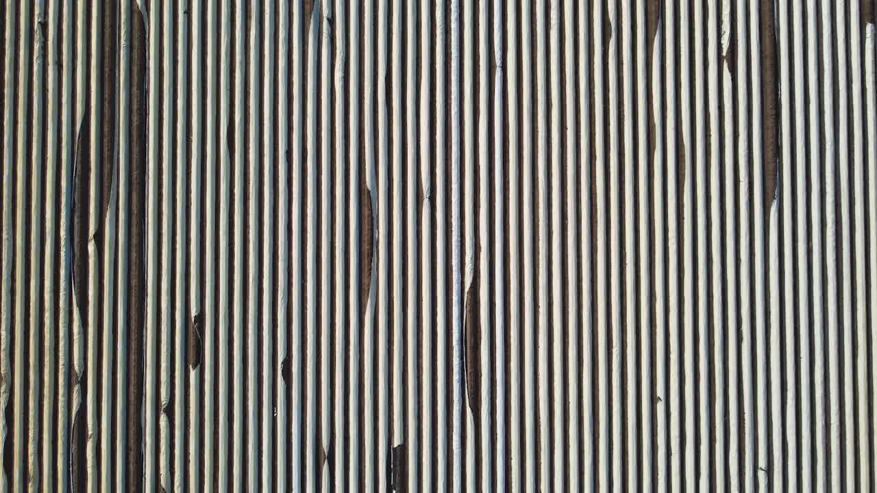 A drone shot of a large asparagus field in the Netherlands creating interesting symmetrical lines