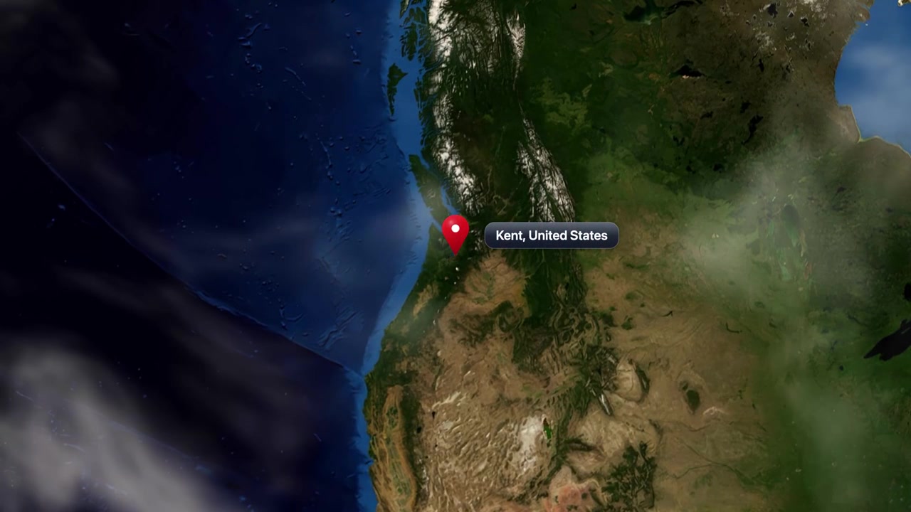 Satellite view camera zooms in from space to pinpoint Kent, Washington in the United States. Includes NASA public domain imagery.