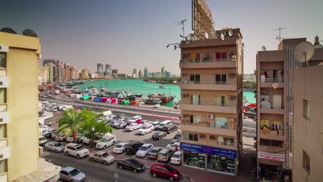 sunny day deira roof top dubai creek panorama 4k time lapse united arab emirates